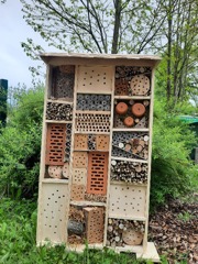 Wooden insect hotel in a garden